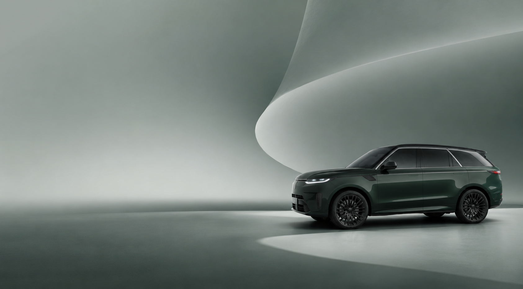 Luxury SUV parked in studio lighting.